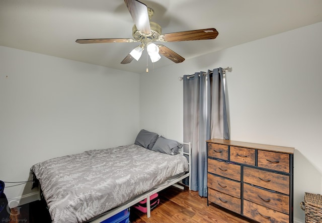 bedroom featuring wood finished floors and a ceiling fan