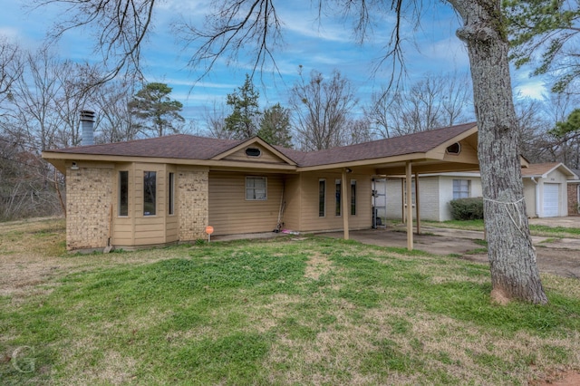 ranch-style house with a front lawn, a chimney, and brick siding