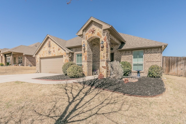 view of front facade with brick siding, a shingled roof, a garage, stone siding, and driveway