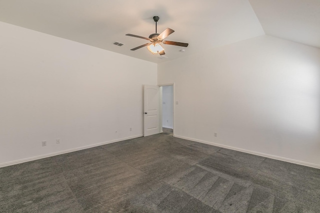 unfurnished room with visible vents, baseboards, lofted ceiling, ceiling fan, and dark carpet