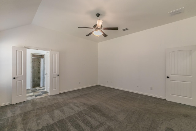 spare room featuring ceiling fan, carpet flooring, visible vents, baseboards, and vaulted ceiling