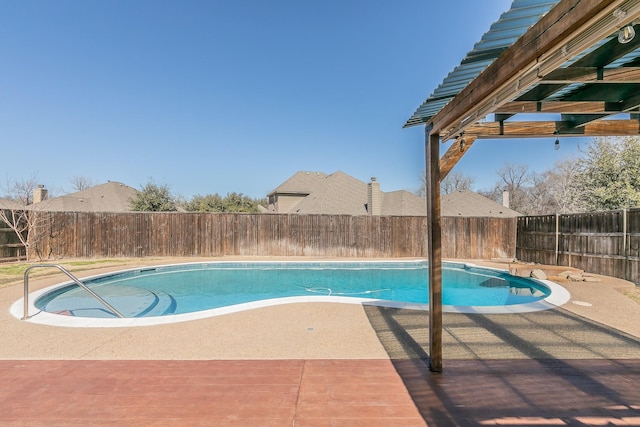 view of swimming pool featuring a patio, a fenced backyard, and a fenced in pool