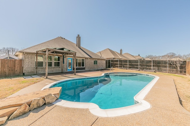 view of swimming pool featuring a fenced in pool, a patio area, and a fenced backyard