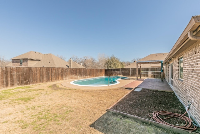 view of yard with a patio area, a fenced backyard, and a fenced in pool