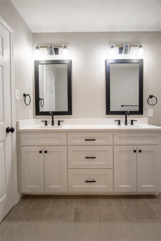 bathroom featuring double vanity and a sink