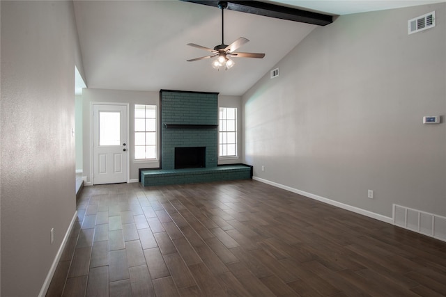 unfurnished living room with beamed ceiling, dark wood-style flooring, and visible vents