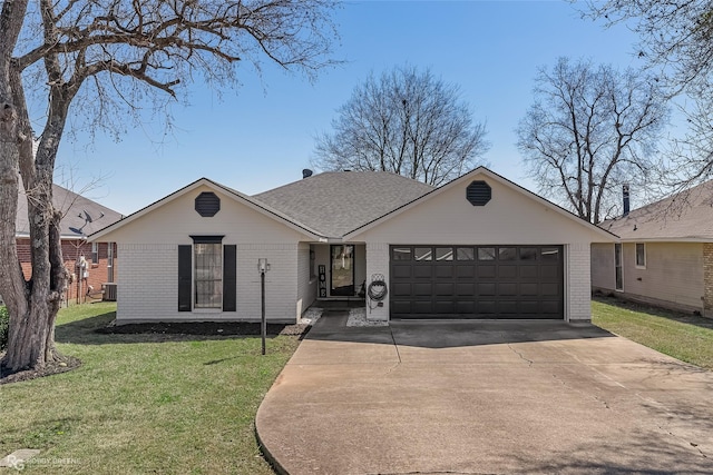 ranch-style home with a garage, a front yard, concrete driveway, and brick siding