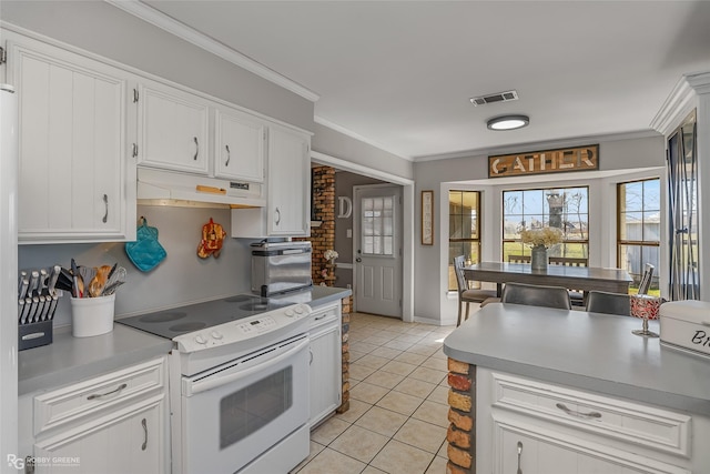 kitchen with white electric stove, visible vents, ornamental molding, white cabinetry, and under cabinet range hood