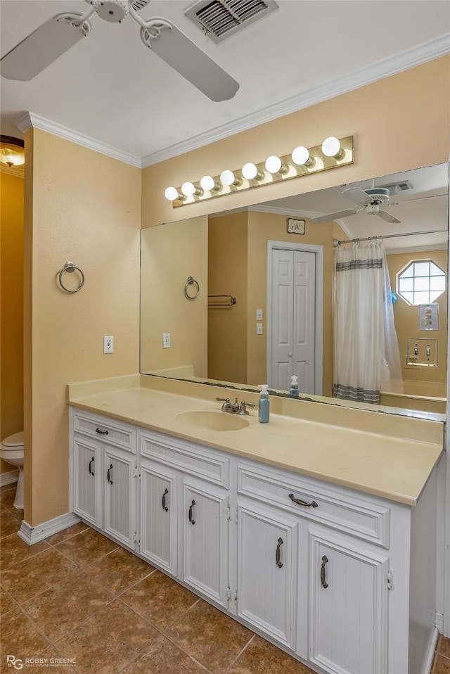 bathroom featuring toilet, vanity, visible vents, a ceiling fan, and ornamental molding