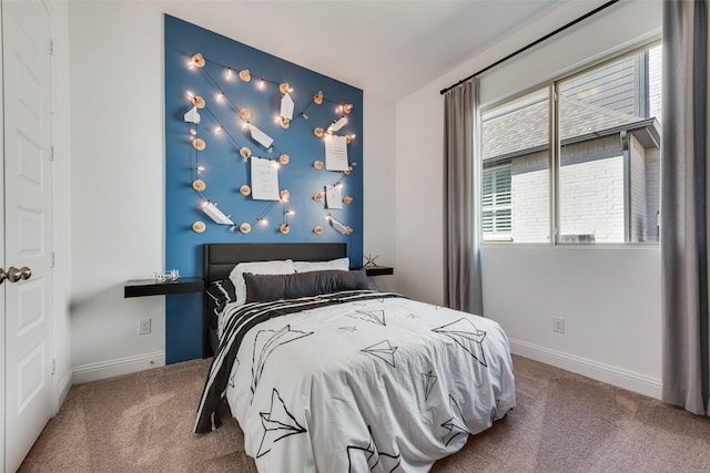 carpeted bedroom with baseboards