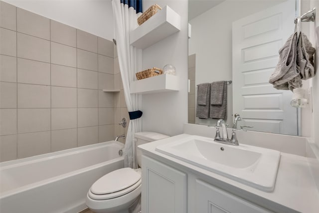 full bath featuring shower / bathtub combination with curtain, toilet, and vanity