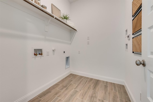 laundry area featuring laundry area, baseboards, wood finish floors, washer hookup, and electric dryer hookup