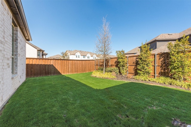 view of yard featuring a fenced backyard