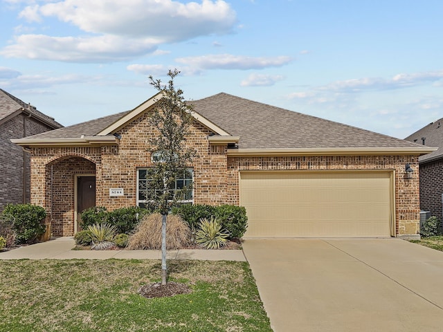 view of front of property with a garage, concrete driveway, brick siding, and roof with shingles