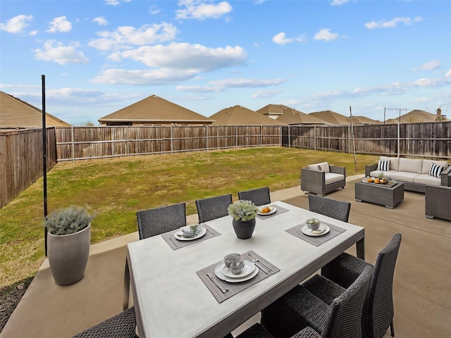 view of patio featuring outdoor dining space, outdoor lounge area, and a fenced backyard