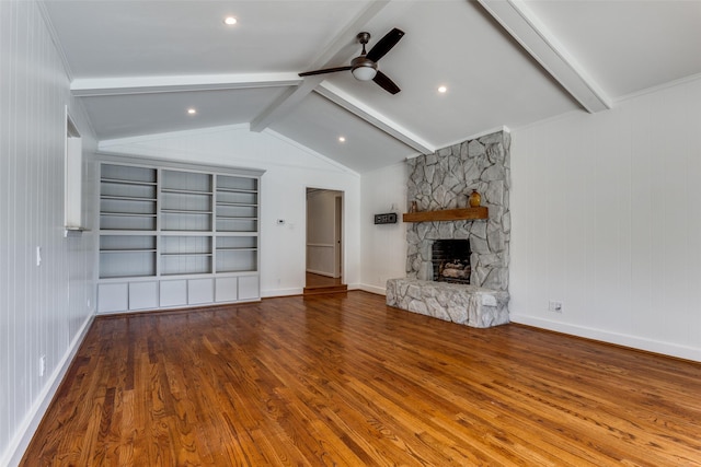 unfurnished living room featuring vaulted ceiling with beams, ceiling fan, a fireplace, and wood finished floors