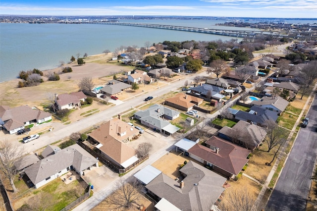 aerial view with a water view and a residential view