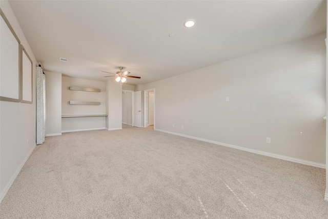 unfurnished room featuring a ceiling fan, recessed lighting, light colored carpet, and baseboards