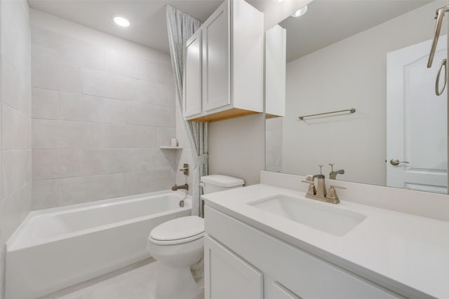 full bathroom featuring tub / shower combination, vanity, and toilet