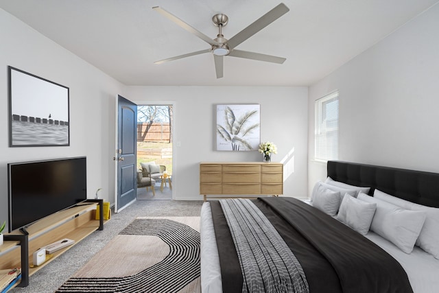 305 W Johnson St, Denison, TX 75020 - bedroom featuring carpet, multiple windows, baseboards, and a ceiling fan