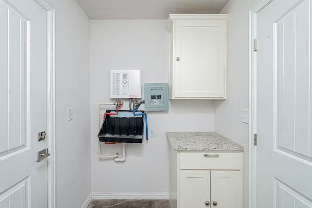 washroom featuring baseboards