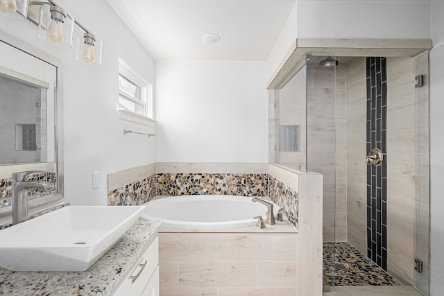 305 W Johnson St, Denison, TX 75020 - bathroom featuring a shower stall, a bath, and vanity