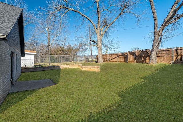 view of yard with a fenced backyard