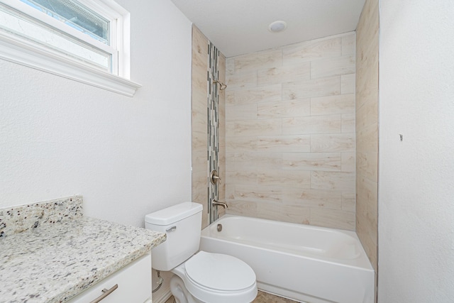 bathroom with toilet, vanity, and washtub / shower combination