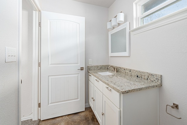 305 W Johnson St, Denison, TX 75020 - bathroom featuring vanity and tile patterned flooring