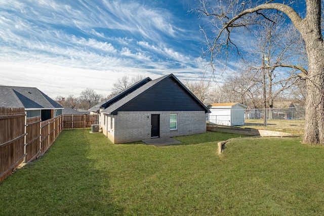 305 W Johnson St, Denison, TX 75020 - rear view of property with brick siding