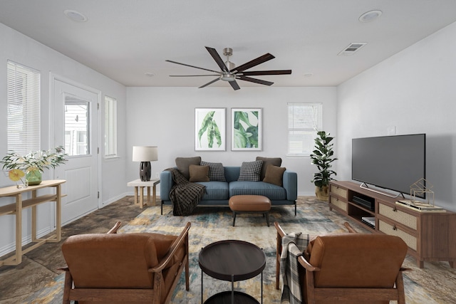 305 W Johnson St, Denison, TX 75020 - living room featuring ceiling fan and baseboards