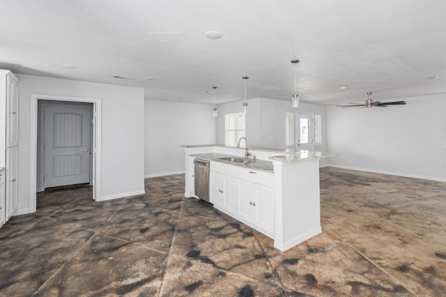 kitchen featuring a center island with sink, white cabinets, open floor plan, a sink, and stainless steel dishwasher