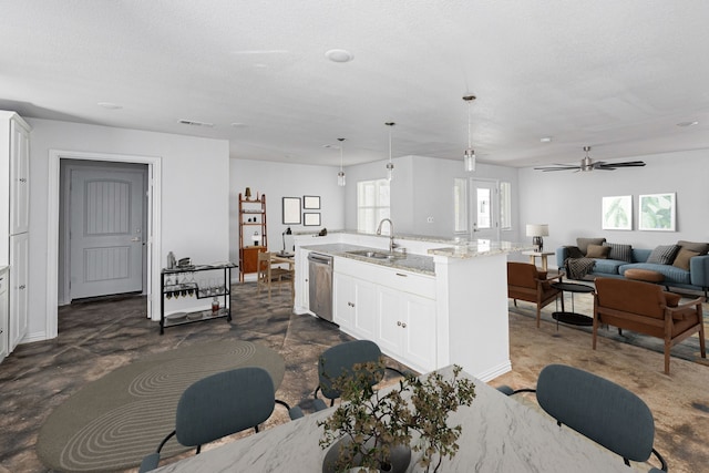 305 W Johnson St, Denison, TX 75020 - kitchen with a sink, stainless steel dishwasher, healthy amount of natural light, and white cabinetry