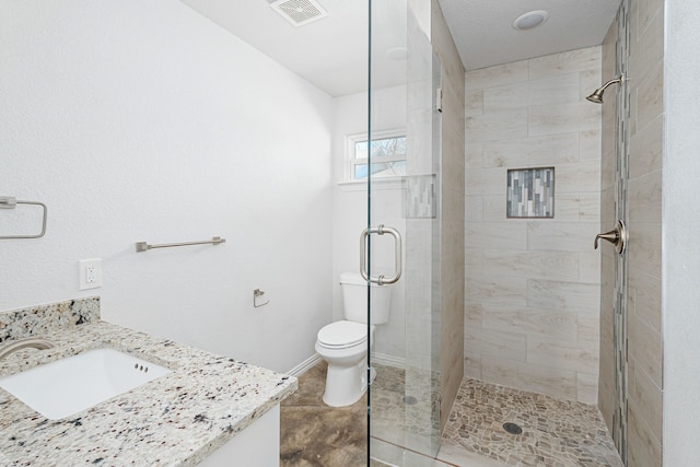 305 W Johnson St, Denison, TX 75020 - full bathroom with a stall shower, toilet, baseboards, and vanity