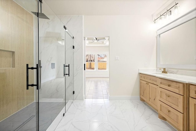 bathroom featuring ceiling fan, vanity, baseboards, marble finish floor, and a marble finish shower