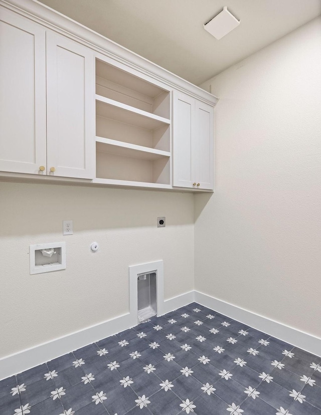 laundry area with hookup for a gas dryer, hookup for an electric dryer, washer hookup, baseboards, and cabinet space