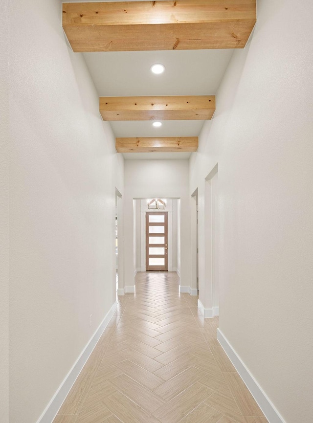 hall featuring recessed lighting, beam ceiling, and baseboards