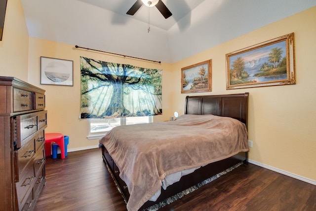 bedroom with dark wood-type flooring, lofted ceiling, baseboards, and a ceiling fan