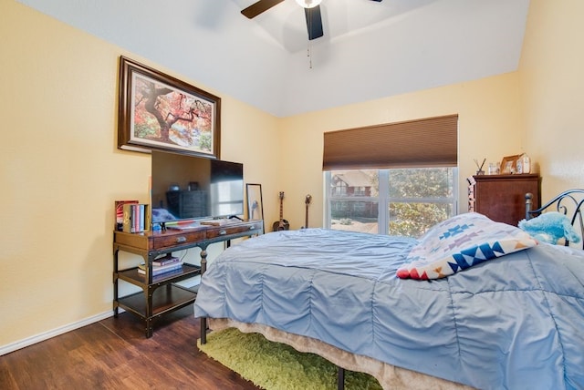 bedroom featuring lofted ceiling, dark wood-style flooring, ceiling fan, and baseboards