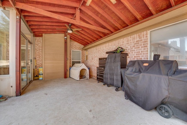 exterior space featuring ceiling fan and area for grilling