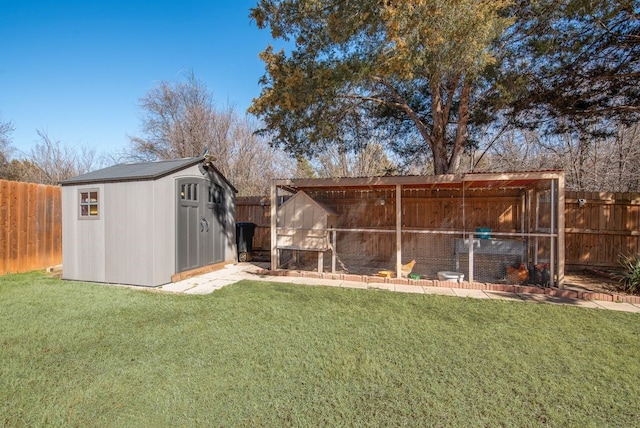 exterior space featuring a fenced backyard and an outdoor structure