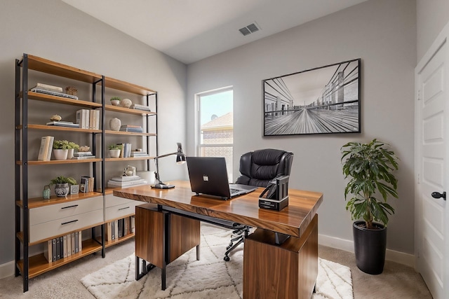 office space with visible vents and baseboards