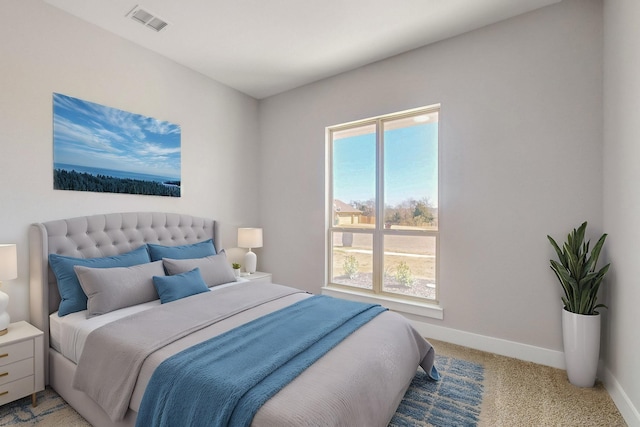 bedroom with baseboards, multiple windows, visible vents, and light colored carpet