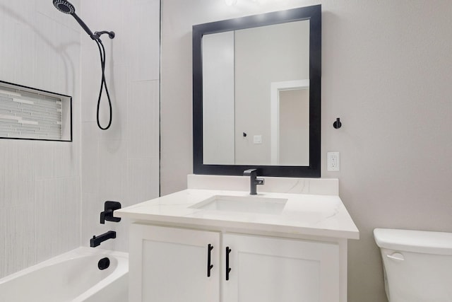 bathroom with shower / bathing tub combination, vanity, and toilet