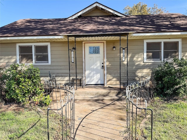 exterior space with a shingled roof