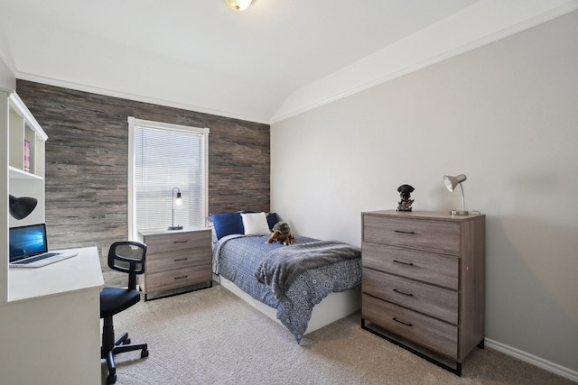 carpeted bedroom with baseboards and vaulted ceiling