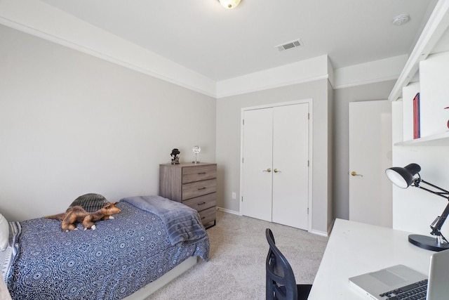 bedroom featuring a closet, carpet, and visible vents