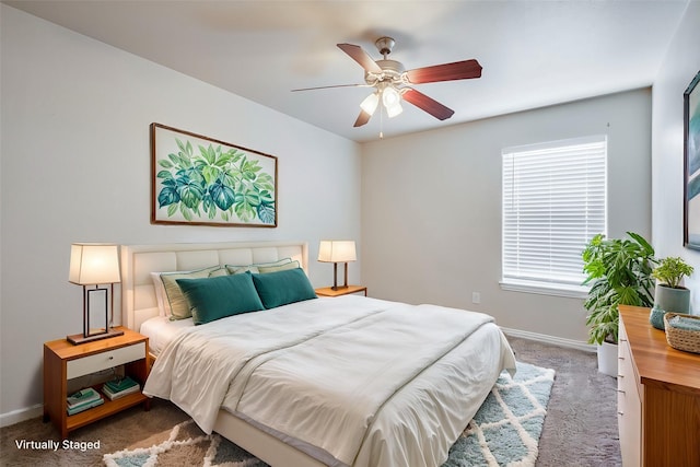 bedroom with ceiling fan, carpet, and baseboards