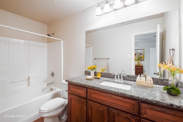 bathroom featuring visible vents, bathtub / shower combination, vanity, and toilet