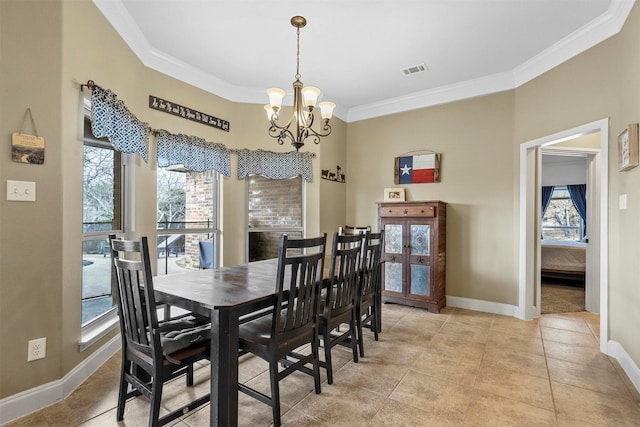 dining space featuring ornamental molding, a healthy amount of sunlight, visible vents, and a notable chandelier